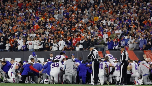 Players from the Buffalo Bills and Cincinnati Bengals gathered for a group prayer after Hamlin was taken from the field. Picture: Getty