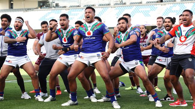 Warriors players, and Martin Taupau from Manly, perform the Haka to honour Adam Blair.