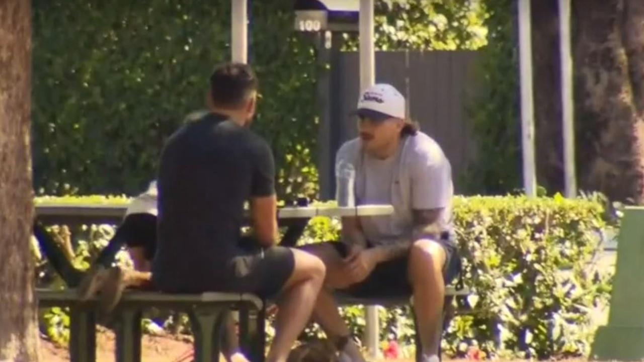 Brisbane Bronco players Darius Boyd and jack Bird seen having lunch and a chat in New Farm Park in Brisbane today, screen grabs from Channel 9 vision