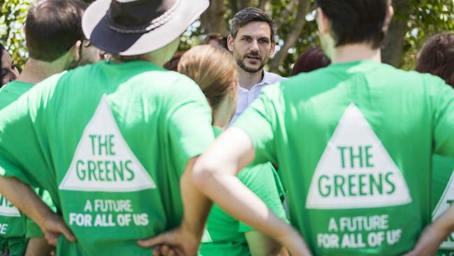 Michael Berkman, surrounded by supporters as he claims the Brisbane seat of Maiwar for the Greens.