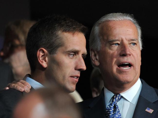 (FILES) In this file photo taken on August 25, 2008 former Democratic vice presidential nominee Sen. Joe Biden (R) is seen with his son Beau Biden at the Democratic National Convention 2008 at the Pepsi Center in Denver, Colorado. - Hunter Biden, whose business dealings in Ukraine have rocked his father Joe Biden's presidential campaign, broke his silence on October 13, 2019 to ease pressure on the former vice president. Hunter Biden will resign October 31 from the board of directors of BHR (Shanghai) Equity Investment Fund Management Company, his lawyer George Mesires said.His role on the board and one in Ukraine has been a frequent target of attacks from President Donald Trump. (Photo by Paul J. RICHARDS / AFP)