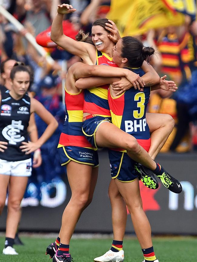 Crows Chelsea Randall celebrates Adelaide’s grand final win over Carlton with teammates including Angela Foley. Picture: Tom Huntley