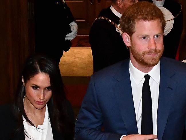 Britain's Prince Harry (R) and his fiancee US actress Meghan Markle (L) arrive to attend the annual Endeavour Fund Awards at Goldsmiths' Hall in London on February 1, 2018. Prince Harry and Meghan Markle attended the second annual Endeavour Fund Awards ceremony in London. The Endeavour Fund Awards celebrate the achievements of wounded, injured and sick veterans who have taken part in remarkable sporting and adventure challenges as part of their recovery and rehabilitation. / AFP PHOTO / POOL AND AFP PHOTO / Ben STANSALL