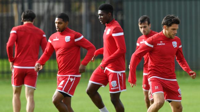 United players are seen during a training session at the Adelaide United Training Centre in Elizabeth on Monday. Picture: AAP Image/David Mariuz