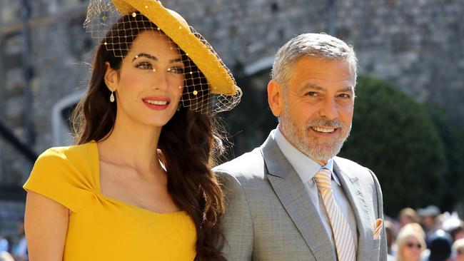 Amal and George Clooney looking chic as they arrive for the royal wedding. Picture: Gareth Fuller/AFP