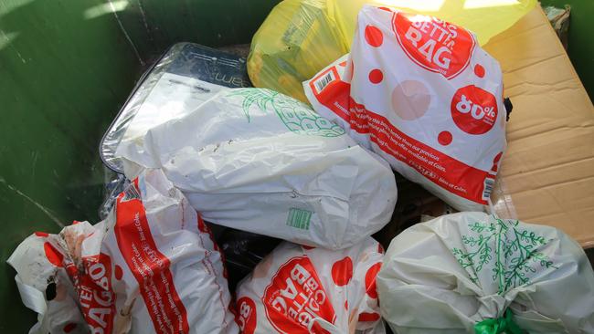 Reusable bags dumped in a skip in Sydney. Pic John Grainger