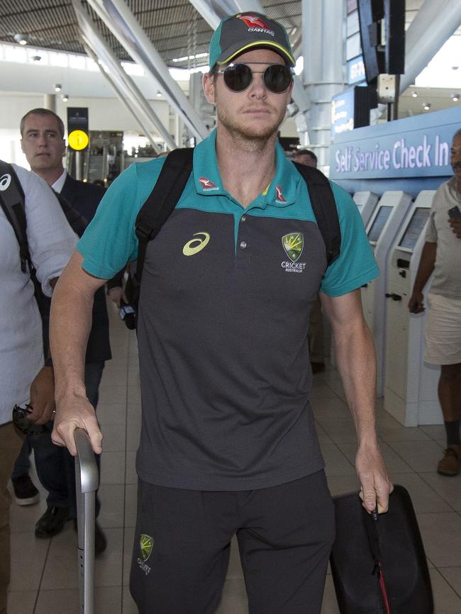 Smith arrives with teammates at the Cape Town International Airport. Picture: Halden Krog