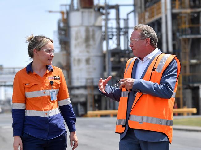 Incitec Pivot worker Christie Rossi (left) is seen with Andrew 'Twiggy' Forrest from Fortescue Future Industries during a hydrogen announcement at Incitec Pivot on Gibson Island in Brisbane, Monday, October 11, 2021.. The Queensland government announced that Incitec Pivot has reached an agreement with Fortescue Future Industries to study the feasibility of green ammonia production at Incitec Pivot's Gibson Island production facility in Brisbane. (AAP Image/Darren England) NO ARCHIVING