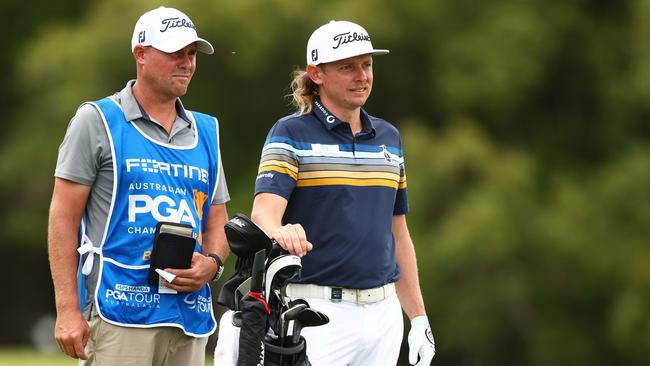 Cameron Smith’s caddie Sam Pinfold (left) is a part owner in the Kelly Schweida-trained Slow Hands. Picture: Chris Hyde — Getty Images.