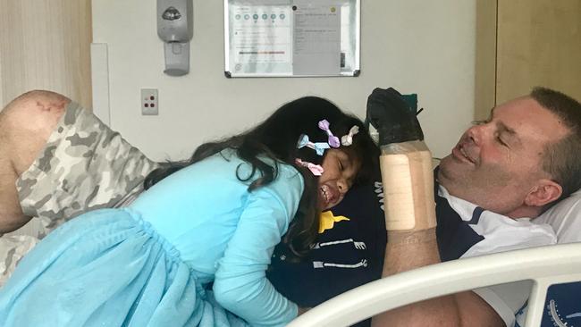 Jason 'Buddy' Miller at Northern Beaches Hospital with his daughter Jhayda, 7. Picture: Supplied.