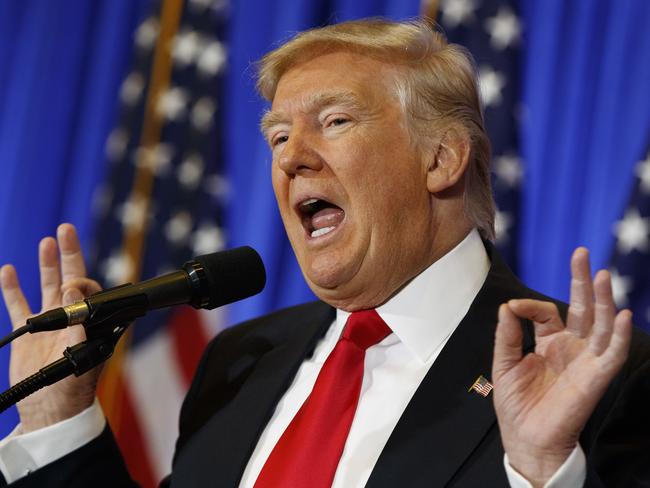FILE - In this Jan. 11, 2017 file photo, President-elect Donald Trump speaks during a news conference in the lobby of Trump Tower in New York. Trump says his team will have a â€œfull report on hacking within 90 days,â€ and is again dismissing as fake a document alleging Russia has damaging information about him. (AP Photo/Evan Vucci)