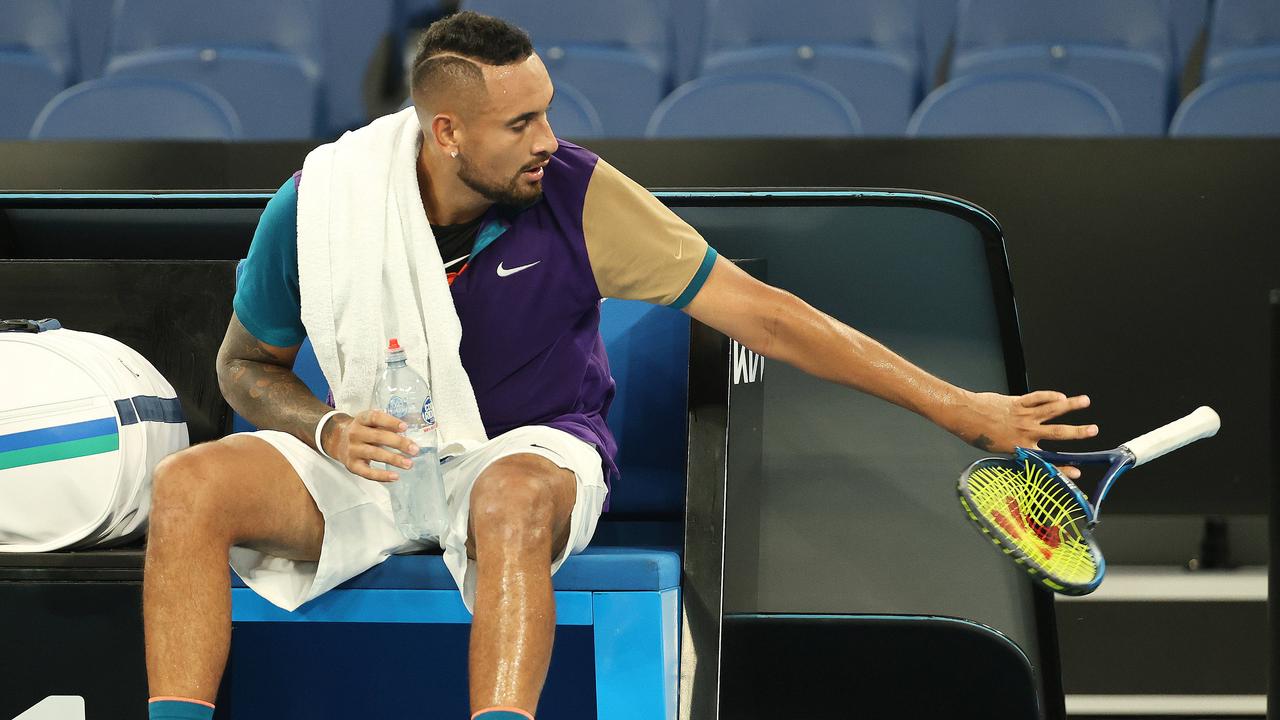 Nick Kyrgios breaks his racquet at the end of the 1st set . Pic: Michael Klein