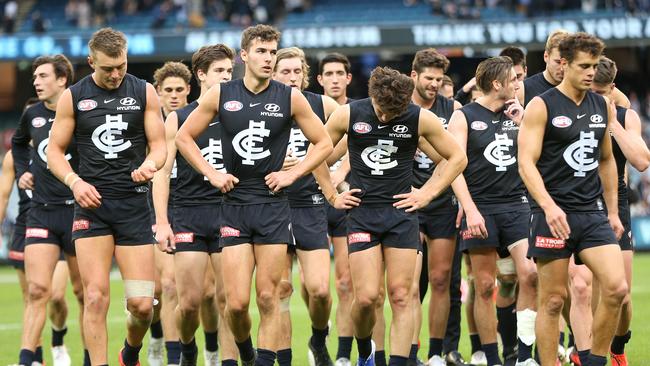 The devastated Blues leave the field after their loss to Collingwood. Picture: AAP Image/Hamish Blair