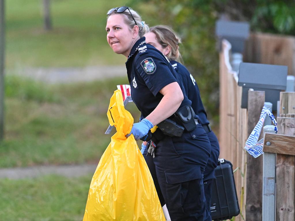 Police take evidence from the Ferricks St home on Sunday. Picture: John Gass