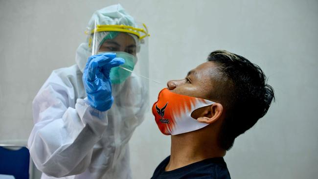 A local football player takes a swab test for the COVID-19 coronavirus at the Syiah Kuala University laboratory in Banda Aceh, Indonesia. Picture: AFP