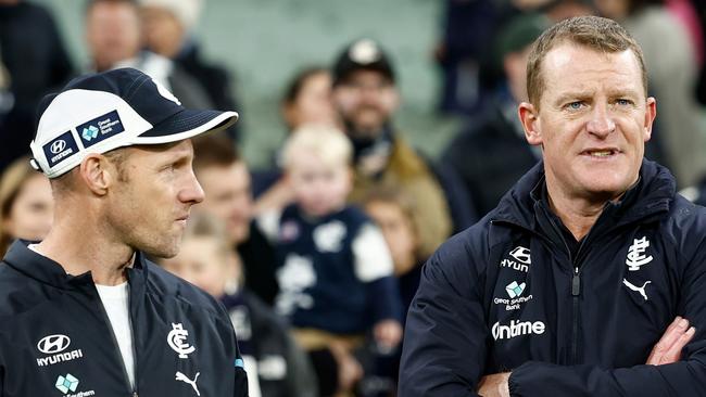 MELBOURNE, AUSTRALIA - JUNE 30: Andrew Russell and Michael Voss, Senior Coach of the Blues are seen during the 2024 AFL Round 16 match between the Richmond Tigers and the Carlton Blues at The Melbourne Cricket Ground on June 30, 2024 in Melbourne, Australia. (Photo by Michael Willson/AFL Photos via Getty Images)