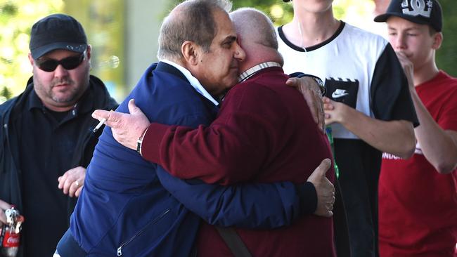 Khalil Eideh embraces office manager Robert Mammarella. Picture: David Smith