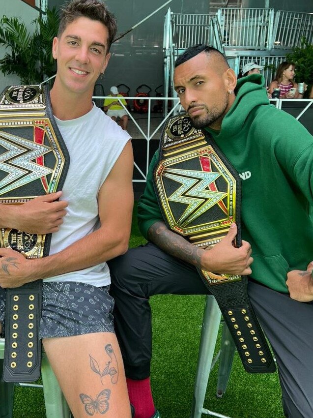 Thanasi Kokkinakis and Nick Kyrgios with their custom Special Ks belt from WWE.