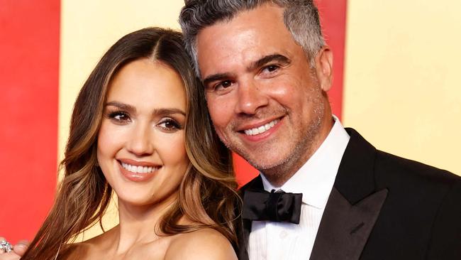 Actress Jessica Alba and husband, film producer Cash Warren, attend the Vanity Fair Oscars Party at the Wallis Annenberg Center for the Performing Arts in Beverly Hills, California, on March 10, 2024. (Photo by Michael TRAN / AFP)