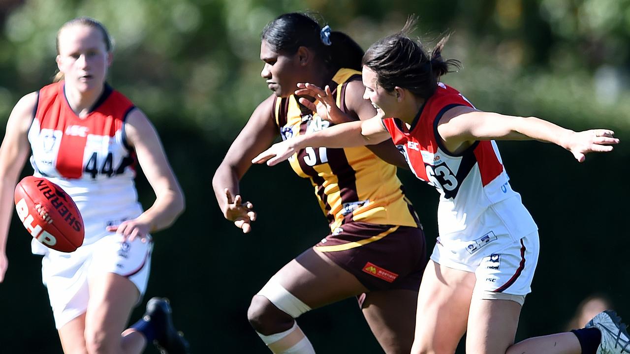 VFLW: Box Hill’s Ashanti Bush gets to the ball ahead of Lucy Schneider from Darebin Falcons. Picture: Steve Tanner