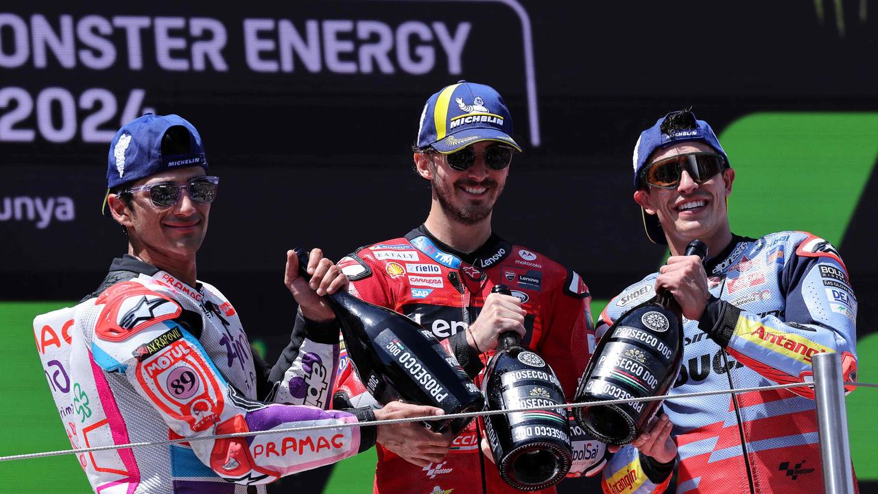 Six events into his Ducati tenure, Marquez (right) is already regularly mixing it with 2023 MotoGP title protagonists Martin (left) and Bagnaia (centre). (Photo by LLUIS GENE/AFP)