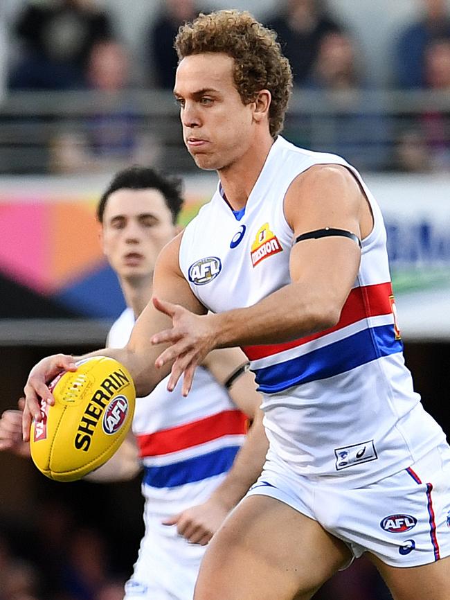 Mitch Wallis in action against Brisbane.