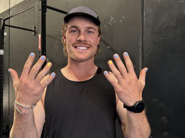 Matt LaFontaine shows off his colouful fingernails.