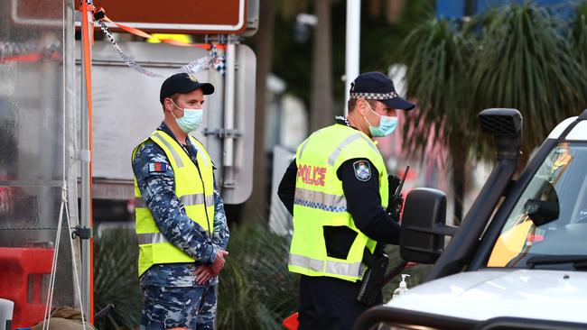 Australian Defence Force and Queensland Police stop cars in Griffith street Coolangatta at the Queensland border (Photo by Chris Hyde/Getty Images)