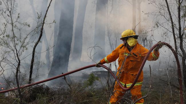 Fire crews fight a spotfire east of Nowa Nowa. Picture: David Crosling