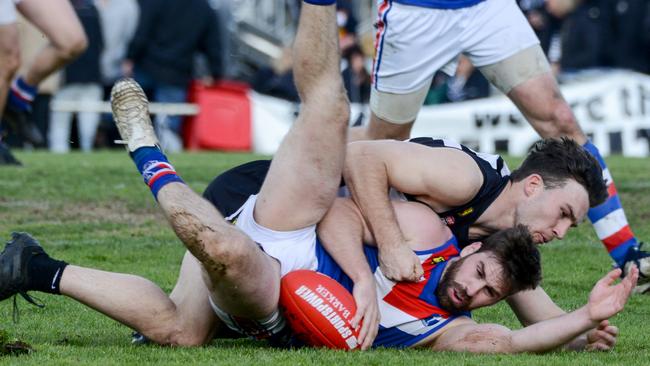 Hahndorf’s Troy Parker-Boers tackles Onkaparinga Valley’s Tim Webber during the 2019 Hills Football League grand final. Picture: AAP/Brenton Edwards