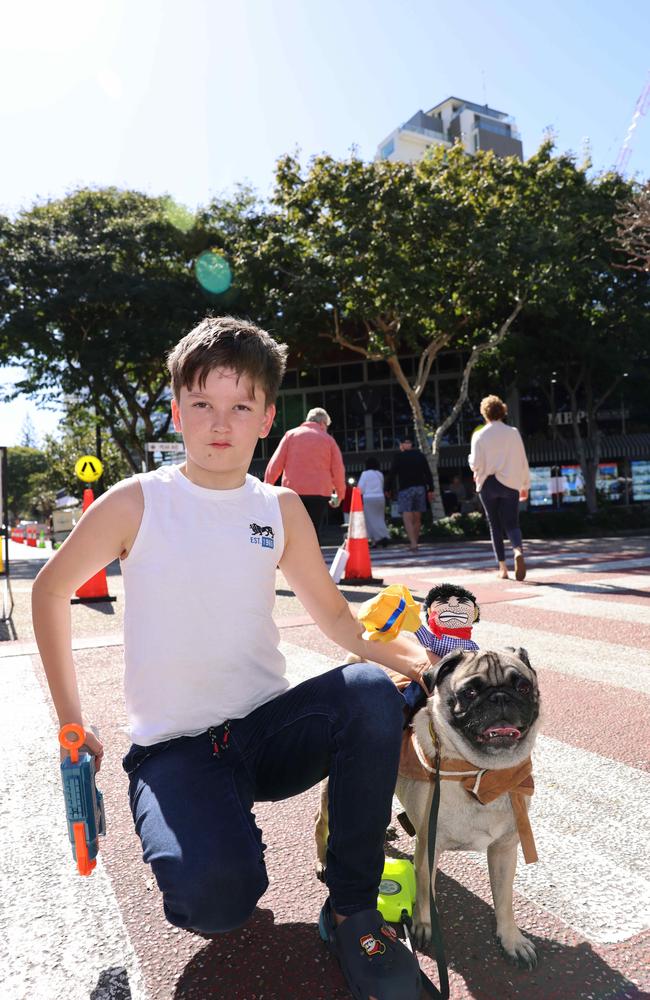 Izaak Roots and Roger at the Ray White Surfers Paradise Next Top Dogel competition on Tedder Avenue Main Beach. Picture, Portia Large.