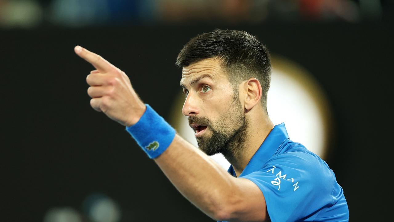 MELBOURNE, AUSTRALIA – JANUARY 17: Novak Djokovic of Serbia points as he celebrates winning match point against Tomas Machac of the Czech Republic in the Men's Singles Third Round match during day six of the 2025 Australian Open at Melbourne Park on January 17, 2025 in Melbourne, Australia. (Photo by Cameron Spencer/Getty Images)