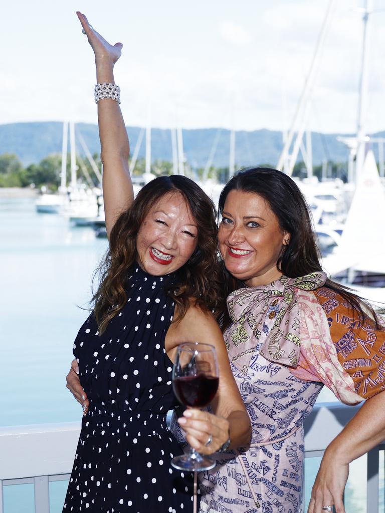 Mo Rowbottom and Louise Montafia kick up their heels at the Longest Lunch, part of the Port Douglas festival, held at Hemmingways Brewery at the Crystalbrook Marina, Port Douglas. Picture: Brendan Radke