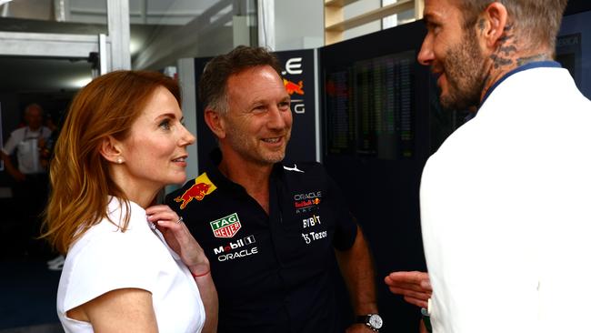 David Beckham talks with Red Bull Racing Team Principal Christian Horner and Geri Horner