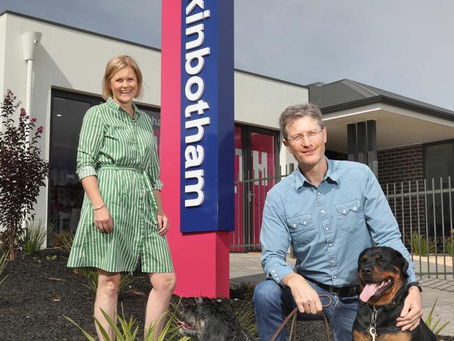 Hickinbotham Group managing director Michael Hickinbotham and sister Ruth Vagnarelli at their Clover Park display home, with dogs, Checkers and Goldie. 28 March 2020. (AAP Image/Dean Martin)