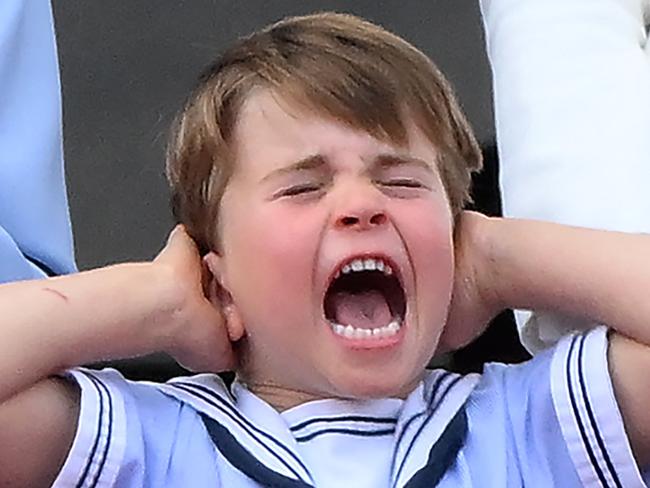 -- AFP PICTURES OF THE YEAR 2022 --  Britain's Prince Louis of Cambridge (R) holds his ears as he stands next to Britain's Queen Elizabeth II to watch a special flypast from Buckingham Palace balcony following the Queen's Birthday Parade, the Trooping the Colour, as part of Queen Elizabeth II's platinum jubilee celebrations, in London on June 2, 2022. - Huge crowds converged on central London in bright sunshine on Thursday for the start of four days of public events to mark Queen Elizabeth II's historic Platinum Jubilee, in what could be the last major public event of her long reign. (Photo by Daniel LEAL / AFP) / AFP PICTURES OF THE YEAR 2022