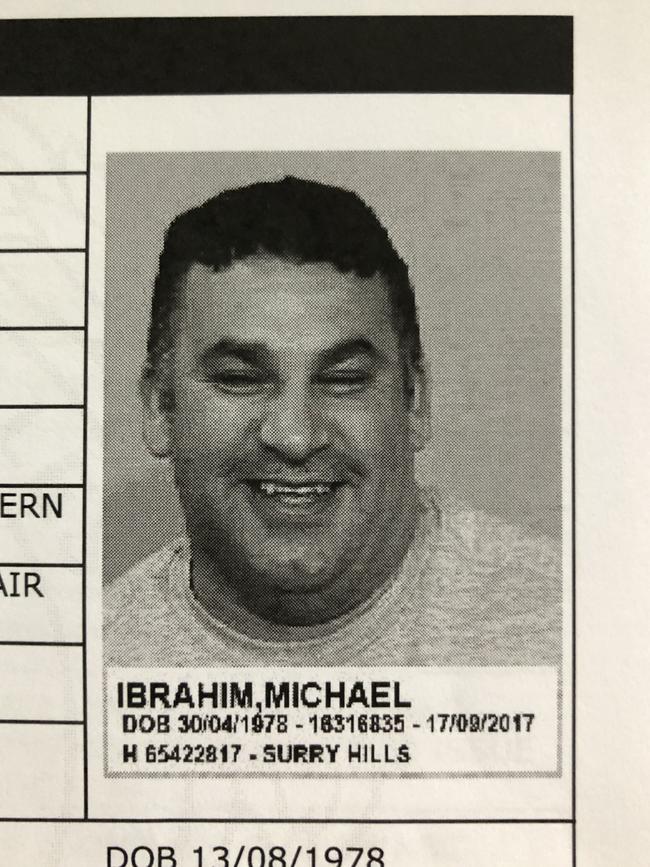 Michael Ibrahim managed to crack a smile for his mugshot after his arrest in 2017.