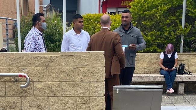 Michael Moresi (right), Velly Mapesone (middle) and Muagututia Pesa (left), with their solicitor outside Toronto Local Court. Picture: Amy Ziniak