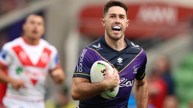 MELBOURNE, AUSTRALIA - MAY 08: Nick Meaney of the Storm makes a break on ho\\is way to scoring a try during the round nine NRL match between the Melbourne Storm and the St George Illawarra Dragons at AAMI Park, on May 08, 2022, in Melbourne, Australia. (Photo by Robert Cianflone/Getty Images)
