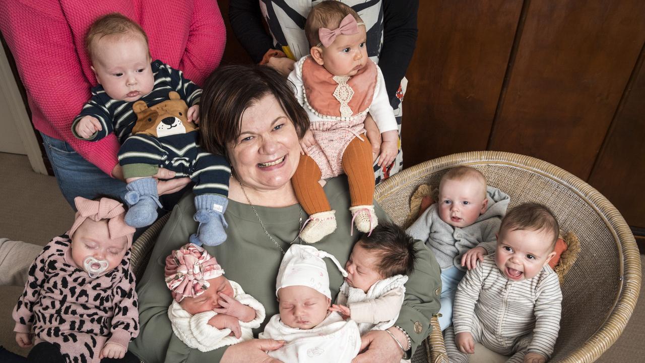 My Midwives director Liz Wilkes with babies she has delivered (from left) Romy Haslem, Henry Curthoys, Poppy Carter, Lucy Paul, Ivy Taylor-Gough, Adalynn Thomas, Dawson Rogers and William Hagan. Picture: Kevin Farmer