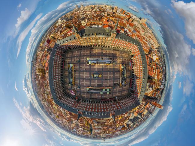 **PLEASE USE CORRECT BYLINE** PIC FROM AIRPANO / CATERSNEWS - (PICTURED: - Plaza Mayor, Mardid, Spain) Some of the worlds most iconic cities have been photographed as youve never seen them before in the shape of tiny round planets. By using a pioneering method of aerial photography, each location can be now seen at a full 360 degree angle. After some skilful manipulation on Photoshop known technically as stereographic projection, each sweeping panorama is then turned into a small circular shaped image. Whether its the Eiffel Tower, The Empire State Building or the Shanghai Skyline, each image manages to show hundreds of miles of city landscape. SEE CATERS COPY