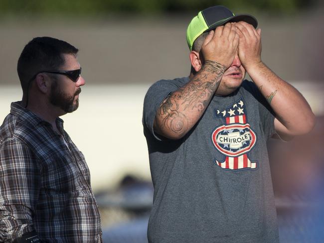 A man wipes his eyes after a deadly shooting at the First Baptist Church in Sutherland Springs, Texas. Picture: AP