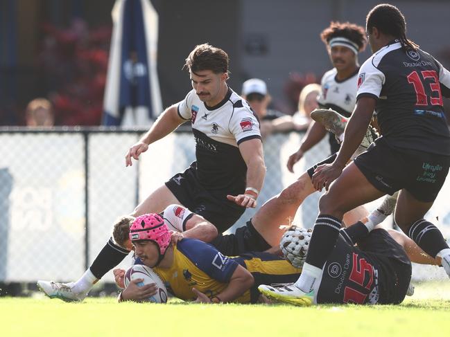 Bond University fullback Dion Samuela scores his first of two tries against Souths Magpies in the 2025 Hospital Cup Round 6 clash at Bond University on May 3, 2025. Picture: Chris Hyde / Bond University