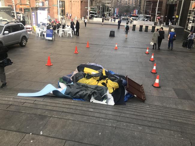 Martin Place campers were piling up the tents in an area cordoned off by police.