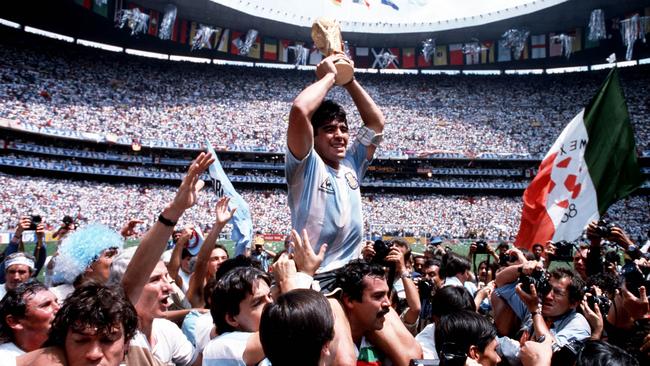 Argentina captain Diego Maradona holds the World Cup trophy in a scene from the documentary movie Diego Maradona.