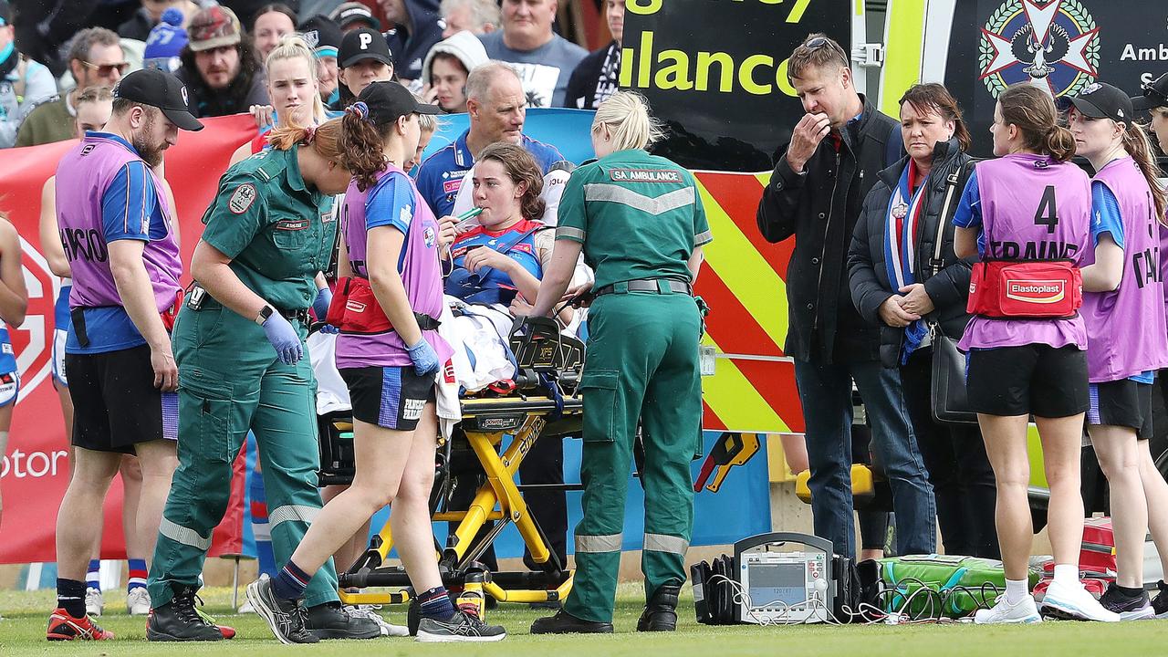 A brave Gutknecht is loaded into the ambulance after the sickening incident. Picture: Sarah Reed/AFL Photos via Getty Images