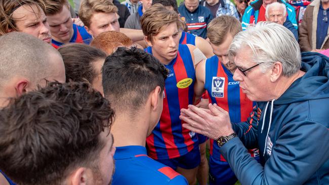 Port Melbourne coach Gary Ayres addresses his players.