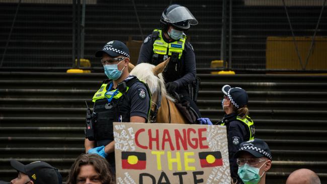 Police officers watch an ‘Invasion Day’ protest in Melbourne on Australia Day last month. Picture: Getty Images