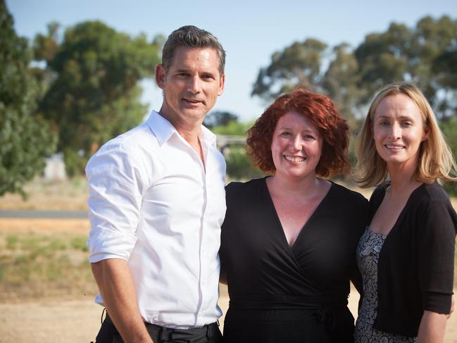 Jane Harper on the set of <i>The Dry</i> film adaptation, with Eric Bana and Genevieve O’Reilly.