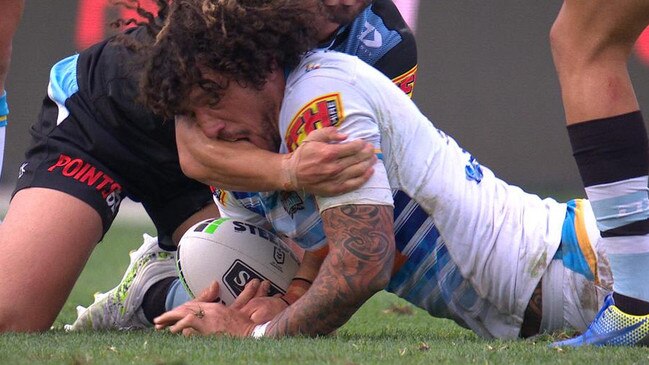 Kevin Proctor bites the arm of Shaun Johnson.